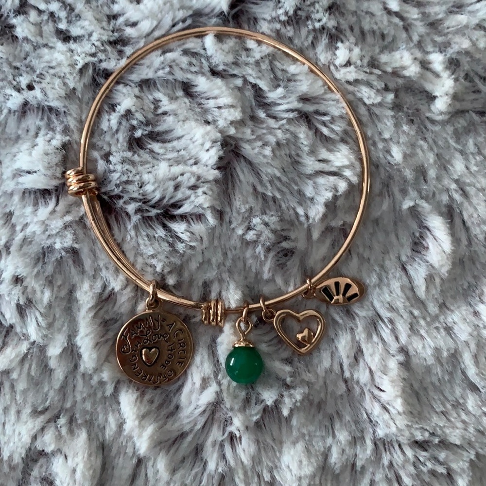 5/$25 gold tone Family bangle bracelet with 4 charms.